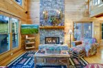 LIVING RM w/GAS LOG FIREPLACE & 65in TV